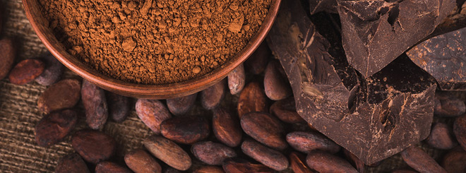 Table with cacao beans and chocolate